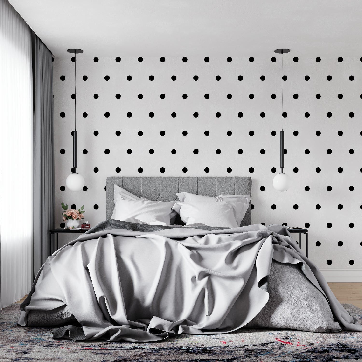 Modern black and white polka dot wallpaper in a minimalist living room setting