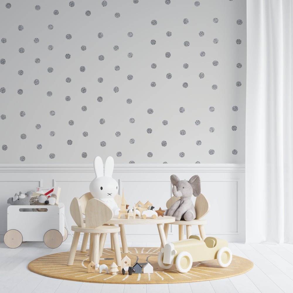 Modern polka dot wallpaper making a powder room feel luxurious and bright