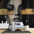Black and gold portrait mural wallpaper creating dramatic impact in a modern living room with high ceilings