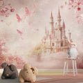 Princess castle wallpaper in a bright girl's bedroom with pink accents and matching decor