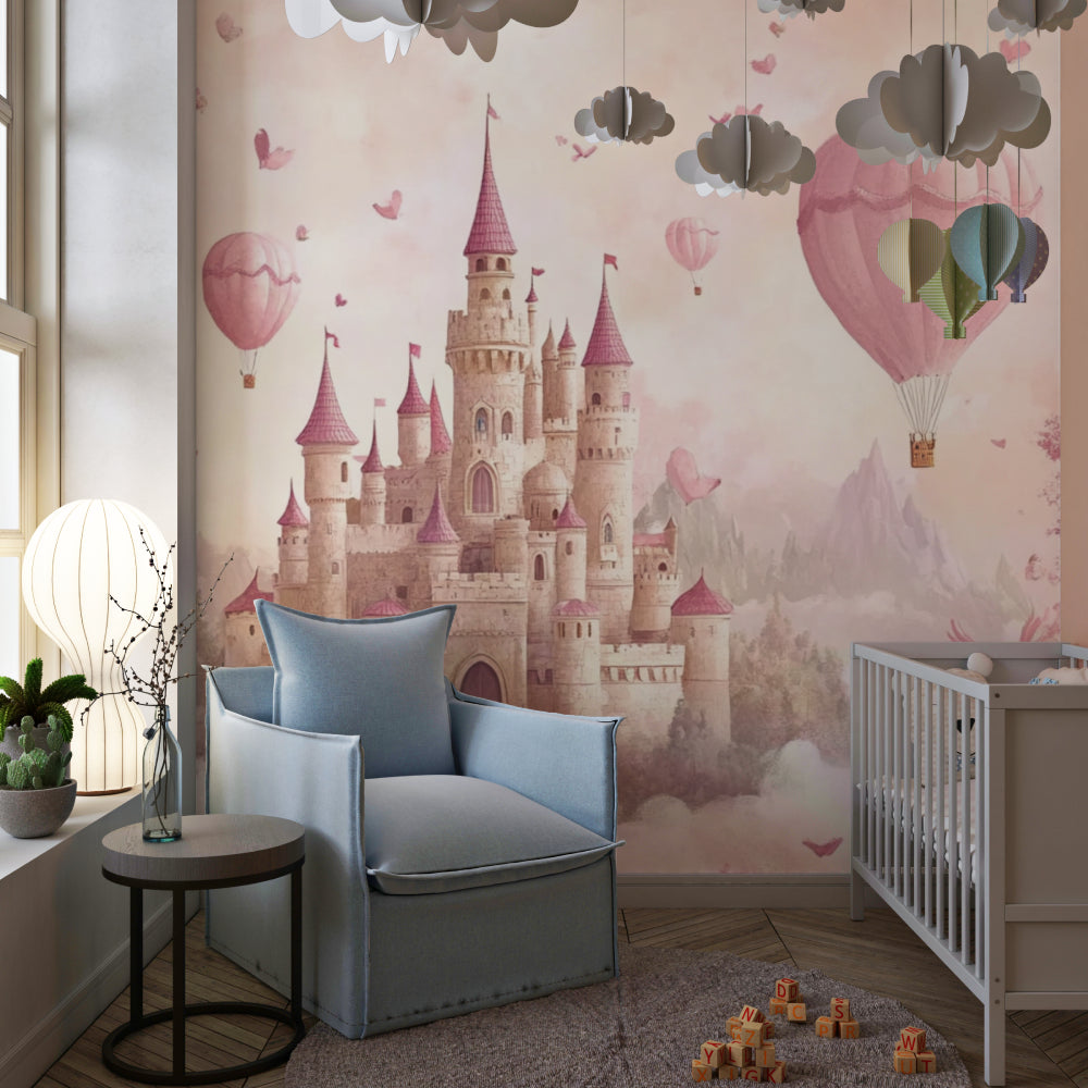 Pink castle mural wallpaper featured in a cozy nursery with matching furniture and gentle lighting