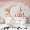 Princess castle wallpaper in a cozy nursery with soft pink accents and reading nook