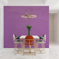 Purple textured wallpaper in modern dining room with pendant lighting highlighting the subtle surface details