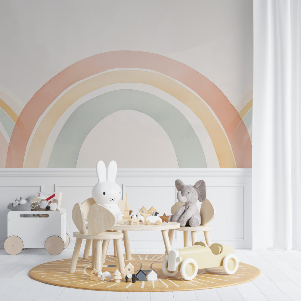 Rainbow nursery wallpaper in modern nursery with white furniture and natural light
