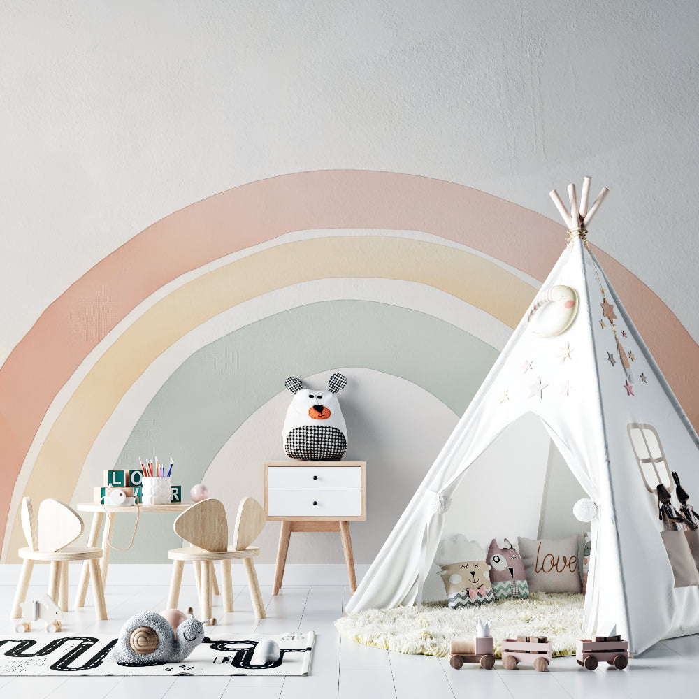 Pastel rainbow mural wallpaper in cozy reading nook with rocking chair