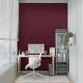 Burgundy wallpaper creating elegant atmosphere in modern living room with contemporary furniture