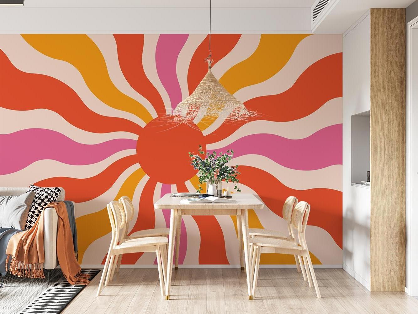 Retro sunburst pattern wallpaper bringing warmth to a modern living room with minimal furniture