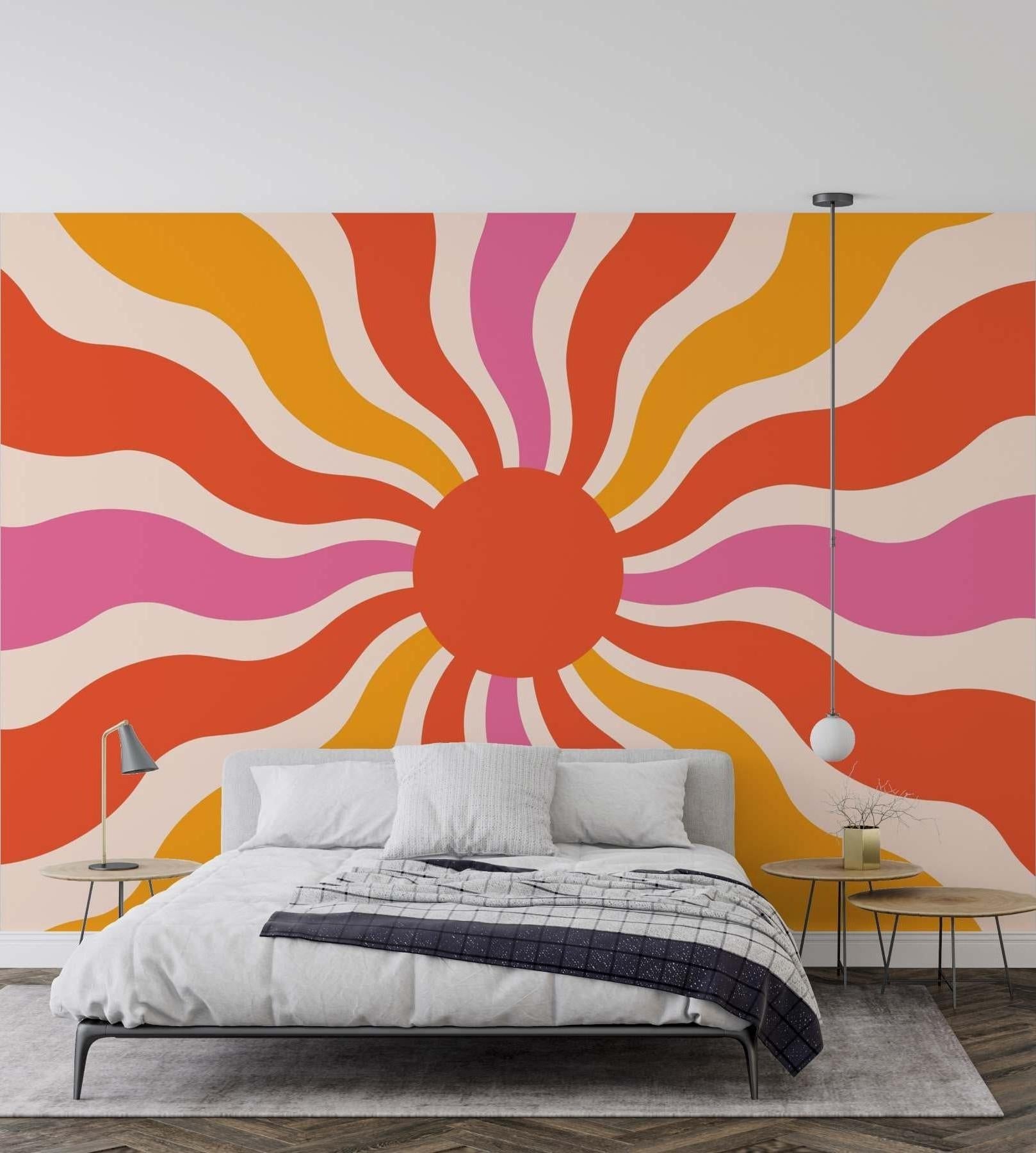 Vibrant sunburst wall mural adding energy to a contemporary dining room setting