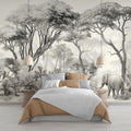 Safari elephant wallpaper mural styled in modern minimalist living room with gray sofa and natural light