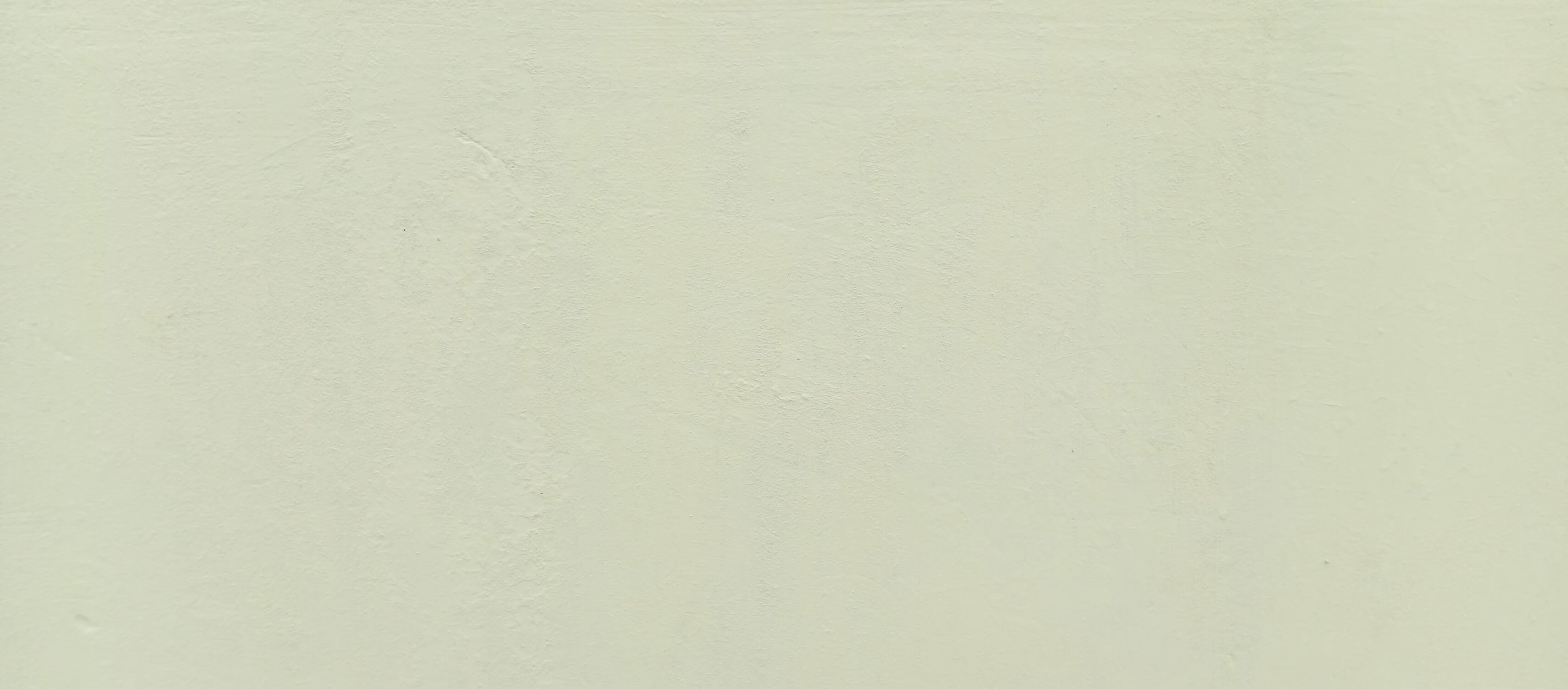 Design file of sage green minimalist wallpaper showing subtle texture and true color