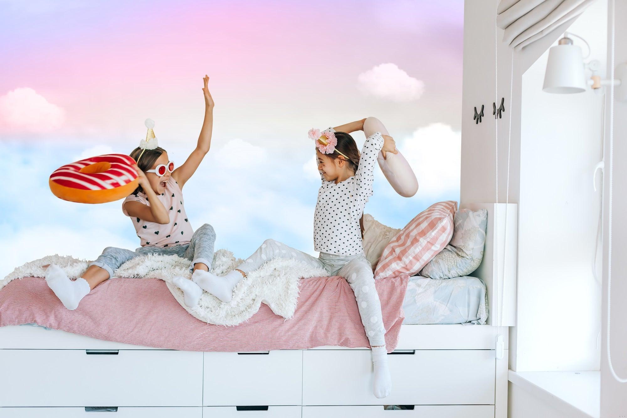 Dreamy sky wallpaper with soft pink clouds bringing serenity to a minimal bedroom setup
