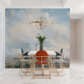 Paris watercolor wallpaper in modern white dining room with natural light streaming through windows