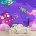 Space themed wallpaper bringing joy to a modern nursery with playful planets and rockets