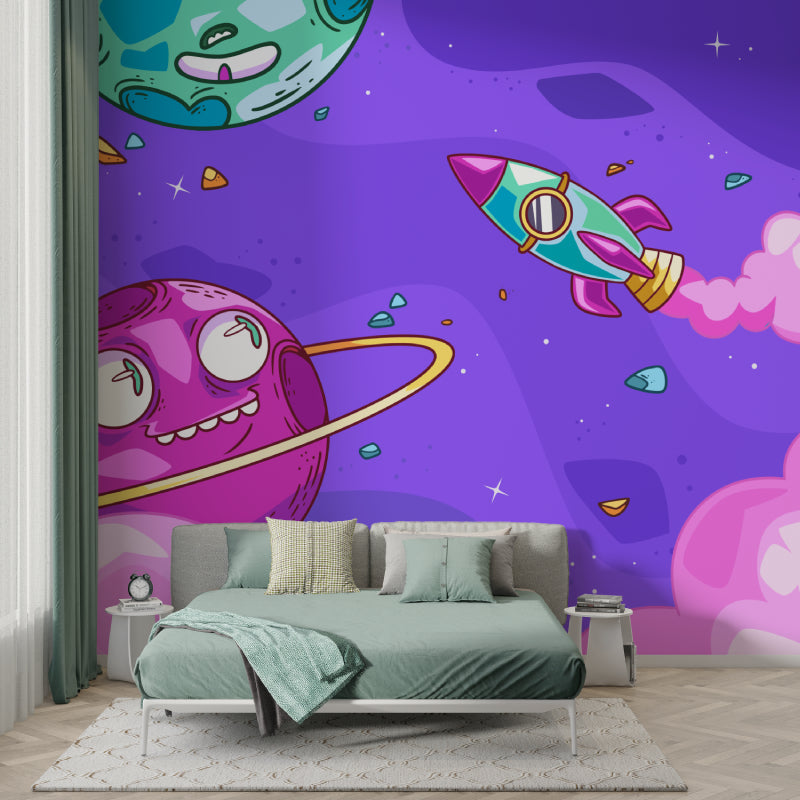 Playroom featuring cartoon space mural with bright rockets and smiling planets