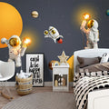 Space wallpaper with glowing planets creating magical atmosphere in modern kids bedroom