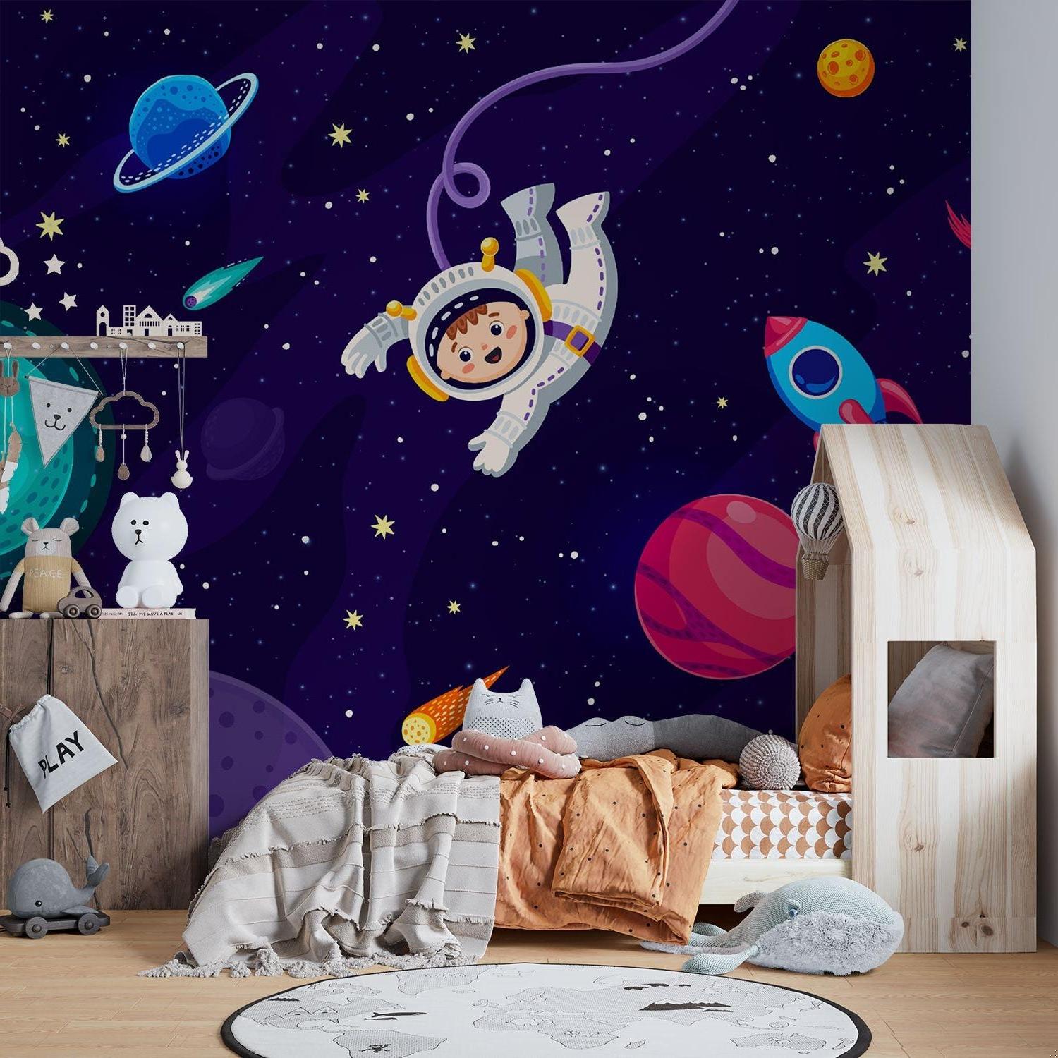 Cosmic wallpaper bringing adventure to nursery with gentle night sky theme