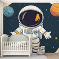 Space themed wallpaper with astronaut and planets shown in a bright modern nursery, creating a magical atmosphere