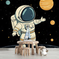 Space exploration wallpaper in modern kids bedroom showing floating astronaut and planets, perfect for inspiring young minds