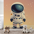 Space themed kids room with cartoon astronaut wallpaper mural showing a playful space explorer floating among stars