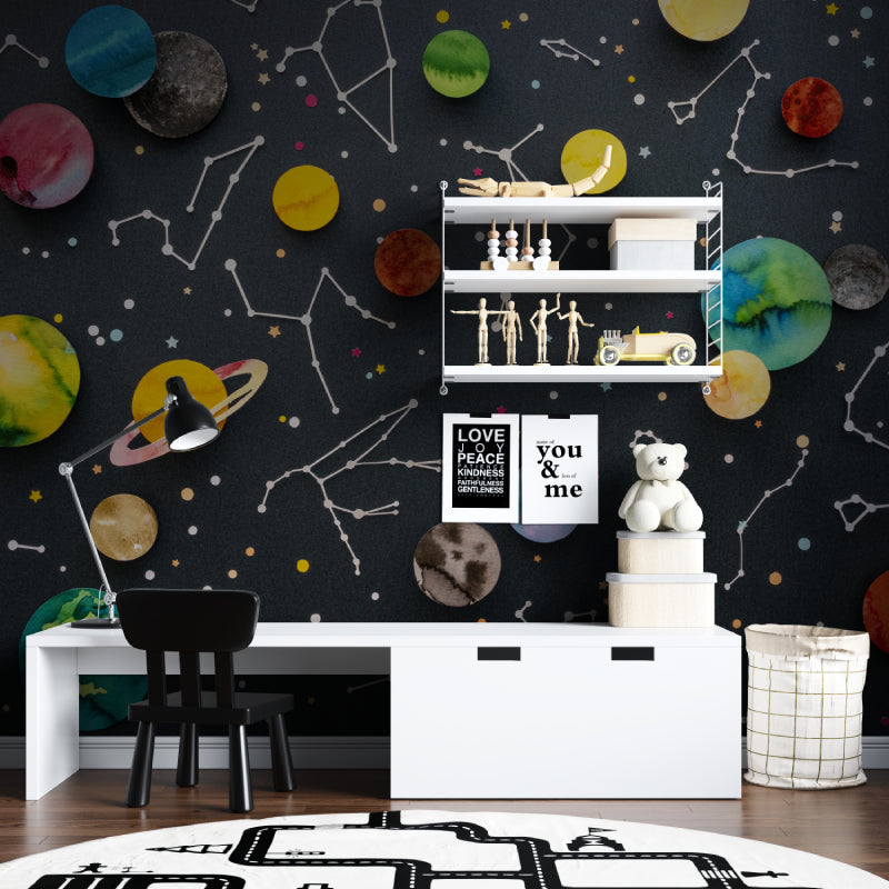 Constellation wall mural creating depth in a teen's gaming room