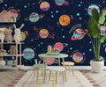 Space mural wallpaper with colorful planets creating a cozy atmosphere in a modern kids bedroom