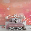 Pink Galaxy wallpaper creates dreamy atmosphere in modern nursery with white furniture