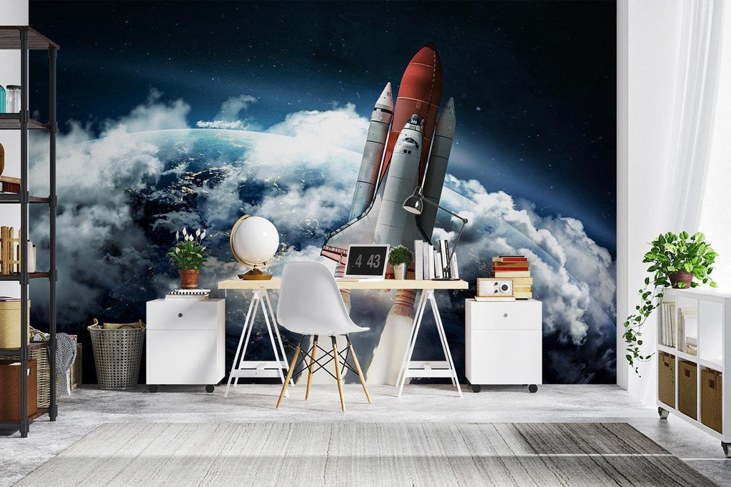 Kids bedroom with space launch mural wallpaper behind study desk and telescope