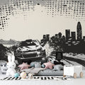Racing car wallpaper in modern teen bedroom showing black and white urban design with dynamic movement