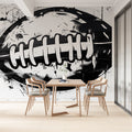 Football wall mural creating a striking focal point in a modern living room with minimalist furniture