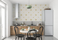 Golden star pattern wallpaper creating a magical atmosphere in a modern bedroom with neutral decor