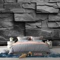 Modern living room featuring dramatic Black Slate Stone Wallpaper creating depth and texture on accent wall