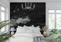 Black stone textured wallpaper in modern living room creating dramatic industrial backdrop