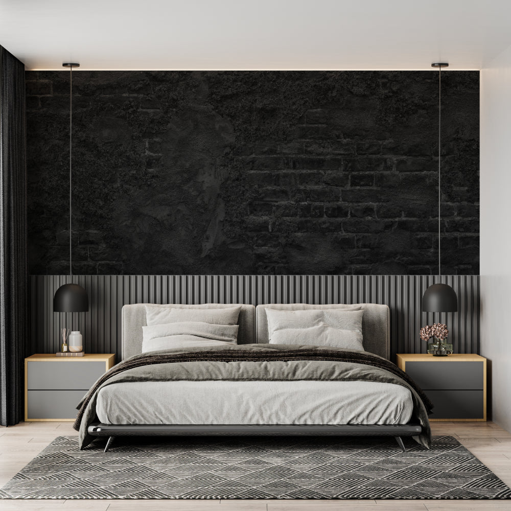 Black stone wall mural creating drama in master bedroom with pendant lights