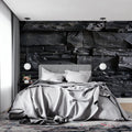 Black stone wallpaper in modern living room with gray sofa and minimalist decor
