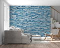 Modern blue stone wallpaper in bright contemporary living room with minimal furniture