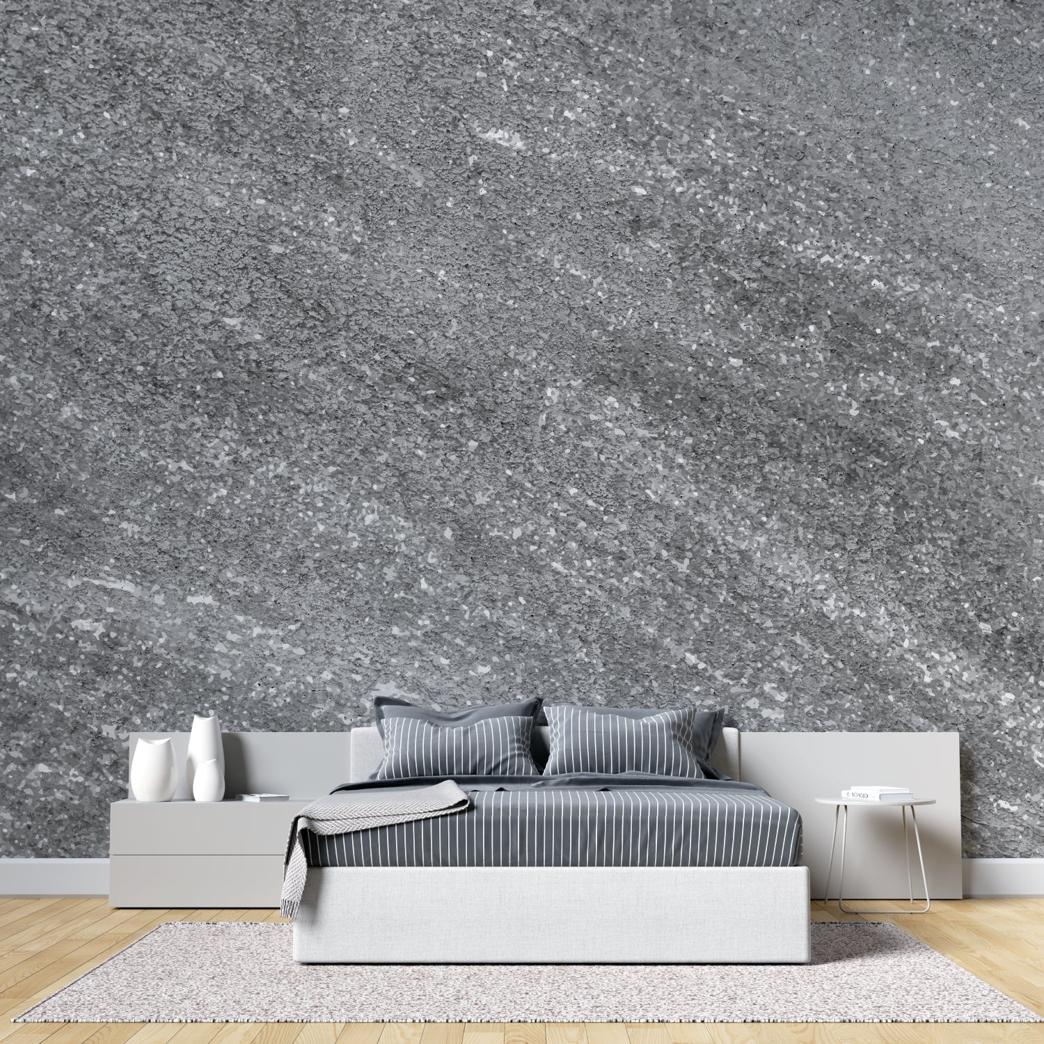 Modern grey stone effect wallpaper in contemporary living room with natural light highlighting metallic details