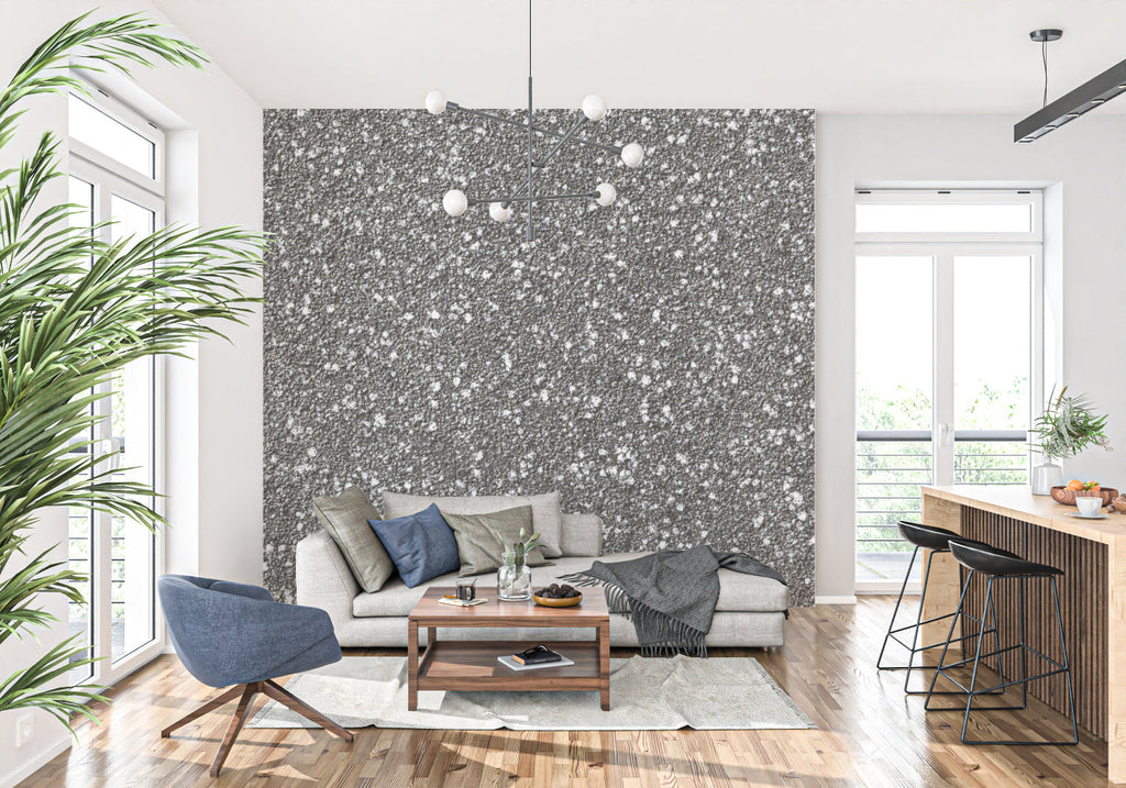 Speckled grey stone mural creating depth in a contemporary dining room