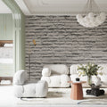 Modern grey stone wallpaper creating depth in a minimal living room setting