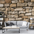 Stone wall mural in a modern living room showing natural limestone texture with warm lighting creating depth and dimension