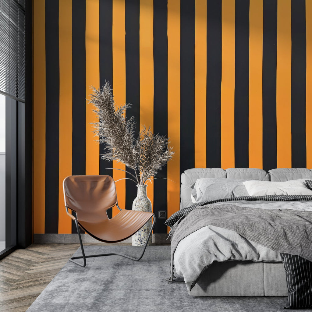 Modern striped wallpaper in orange and black making a bold statement in a minimalist living room