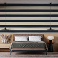 Modern navy blue striped wallpaper in a bright home office, creating a professional and clean backdrop for remote work