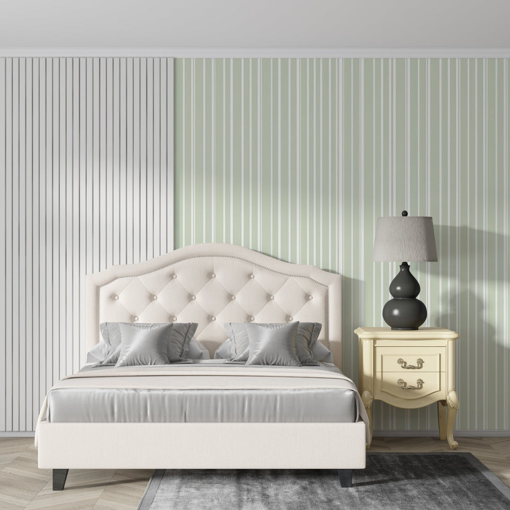 Green and white striped wallpaper in home office setting with natural light