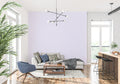 Lavender striped wallpaper in a modern bedroom creating a serene atmosphere with natural light