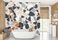 Modern Terrazzo Wallpaper creating a bold statement in a minimalist living room with grey and orange accents