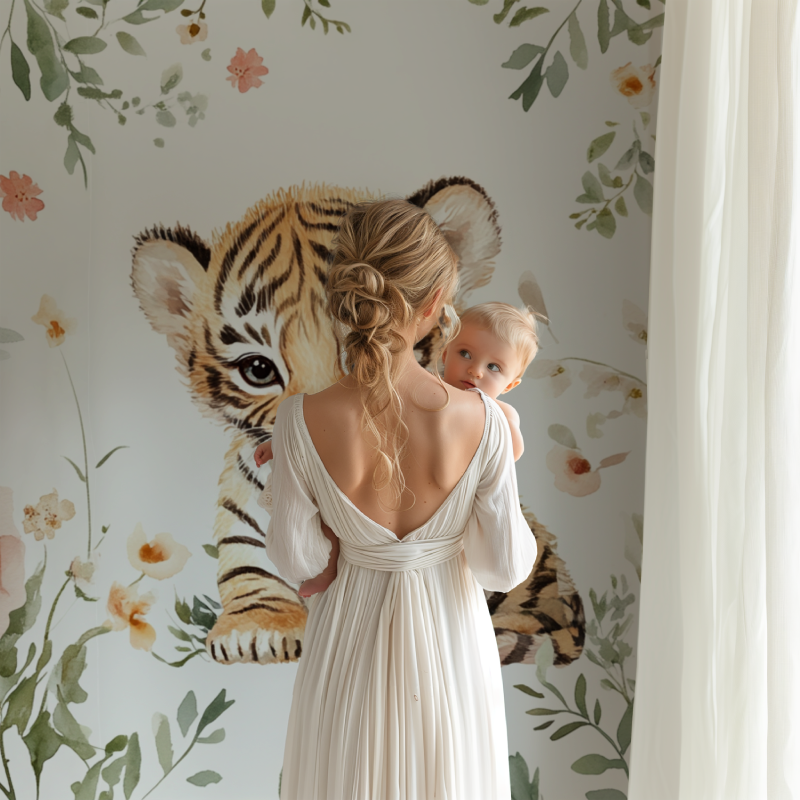 Tiger cub nursery wallpaper in a cozy pink nursery with white furniture and soft lighting