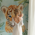 Baby tiger wallpaper creating a magical atmosphere in a modern nursery with soft mint accents