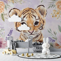 Tiger cub wallpaper in modern nursery with white furniture and soft lighting