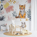 Tiger wallpaper mural in a bright nursery with white furniture showing scale and soft color impact