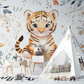 Watercolor Tiger Nursery Wallpaper creating a cozy atmosphere in a modern white nursery with wooden furniture