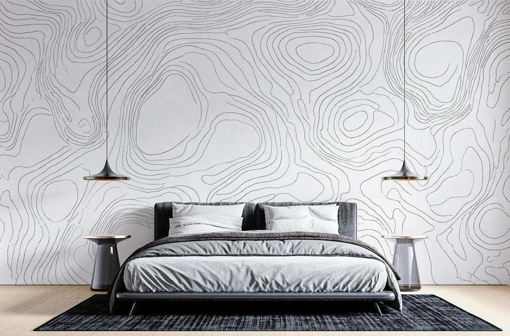 Modern line art wallpaper creating depth in a minimalist living room with natural light